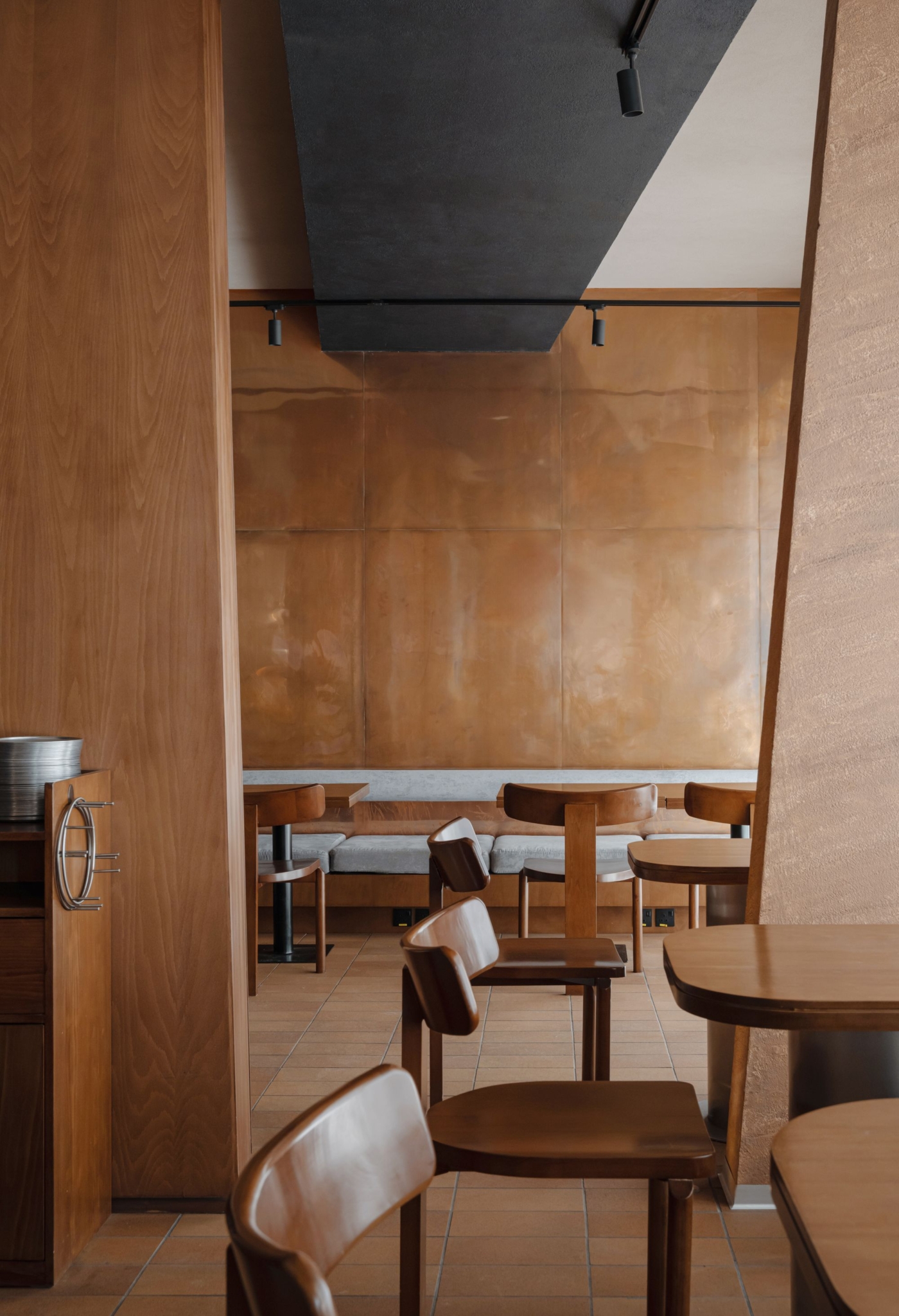 Timber column detail rising through the dining room