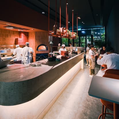 Chefs on the pass at the open kitchen