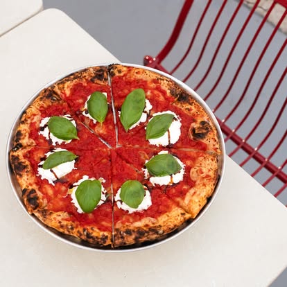 Margo pizza on a steel tray